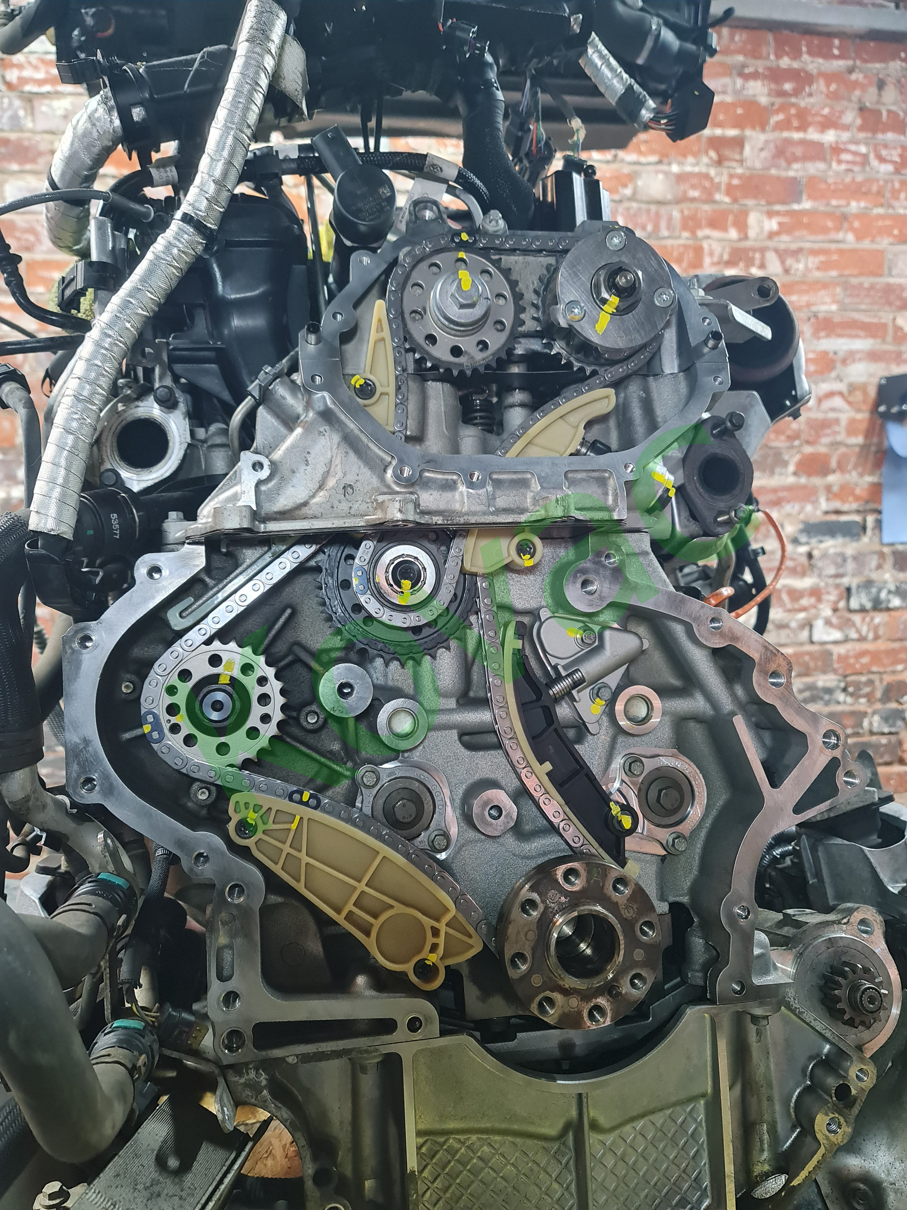 Jaguar Ingenium timing chain fitted with guides and witness marks visible