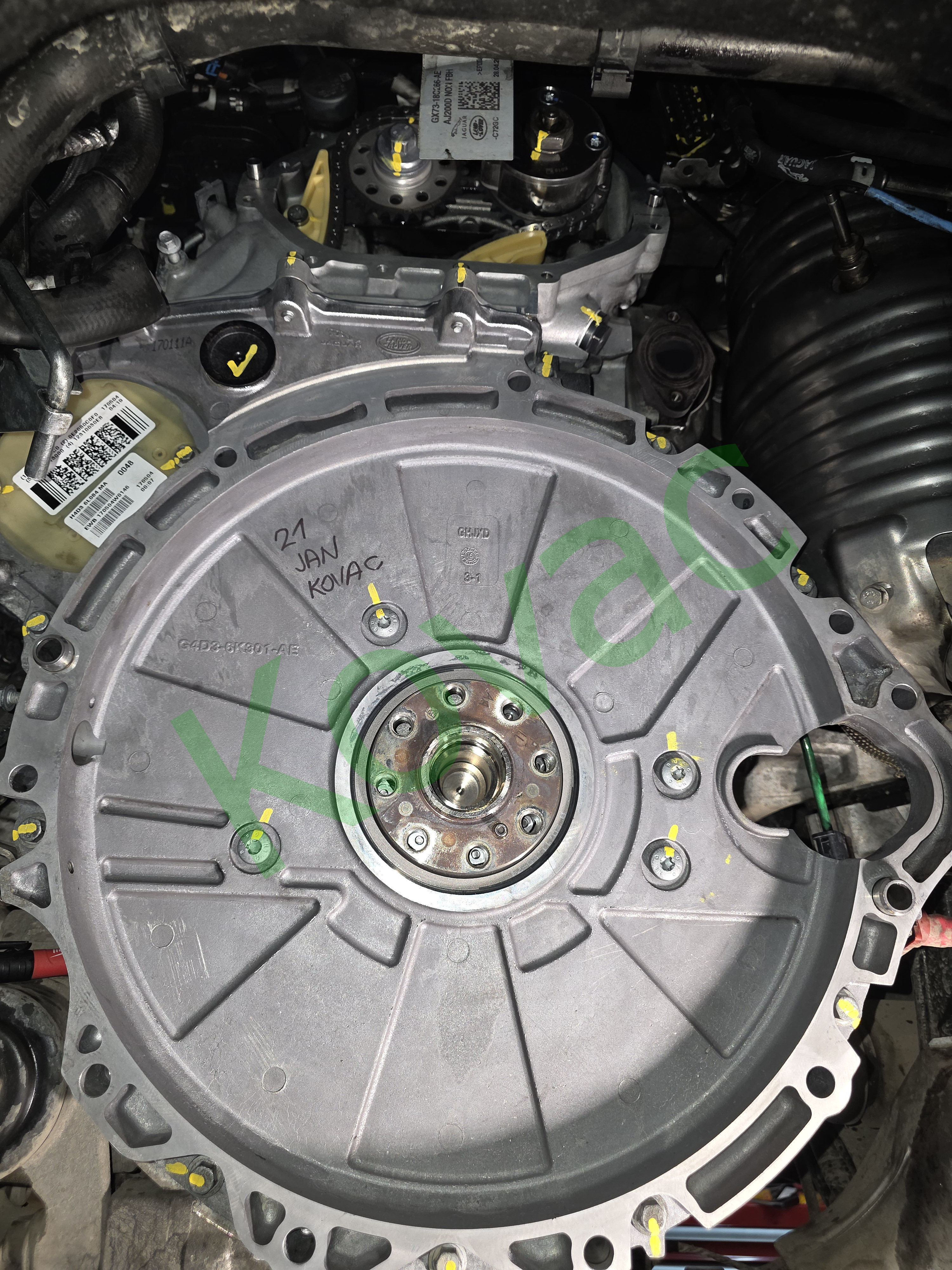 Timing chain cover refitted with all bolts yellow witness marked after torque
